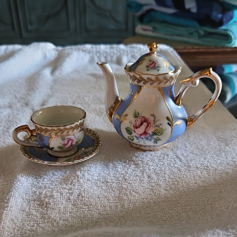 Elegant Blue and Gold Floral Teapot and Teacup Set